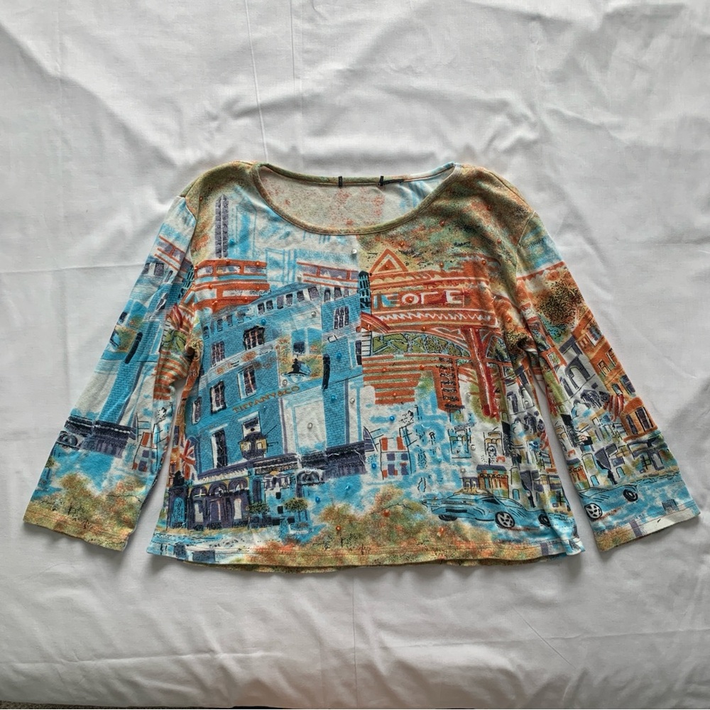 Unique city graphic boat neck top
